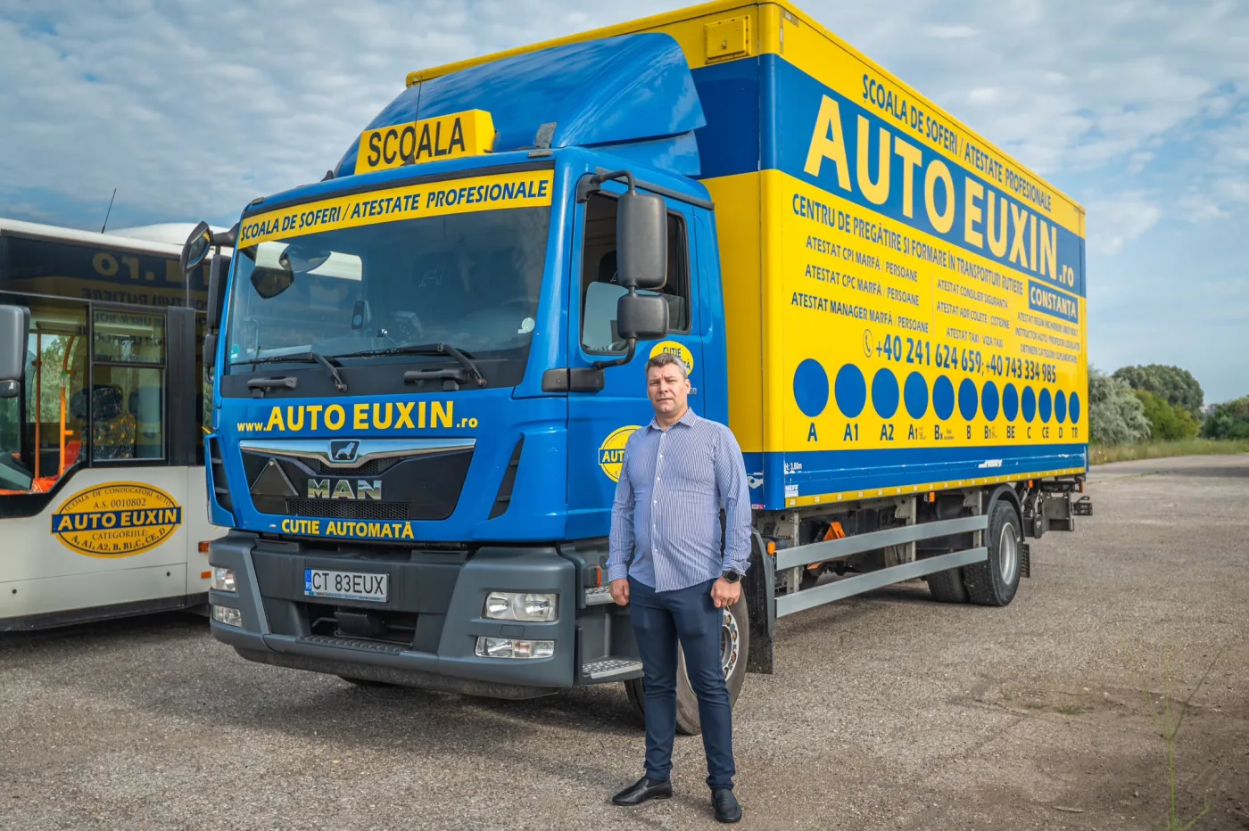 Camion MAN TGM inscripționat Auto Euxin, cu toate categoriile de permis pe caroserie